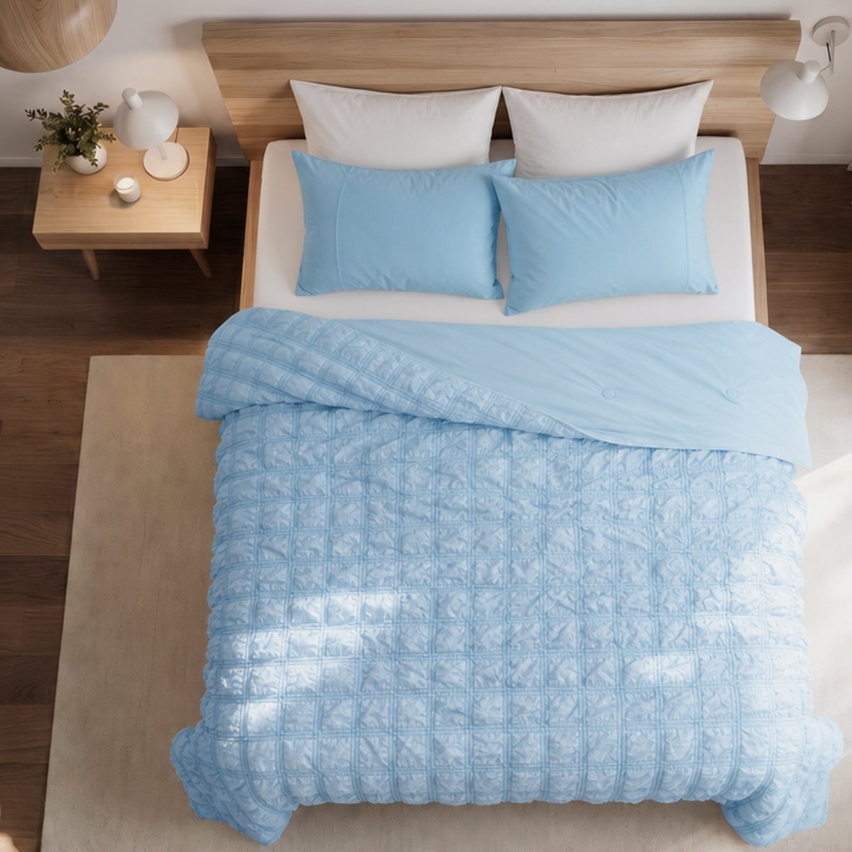 Cozy Bliss white seersucker plaid cooling comforter neatly laid out on a bed, highlighting the textured fabric design for summer.#color_ Sky Blue