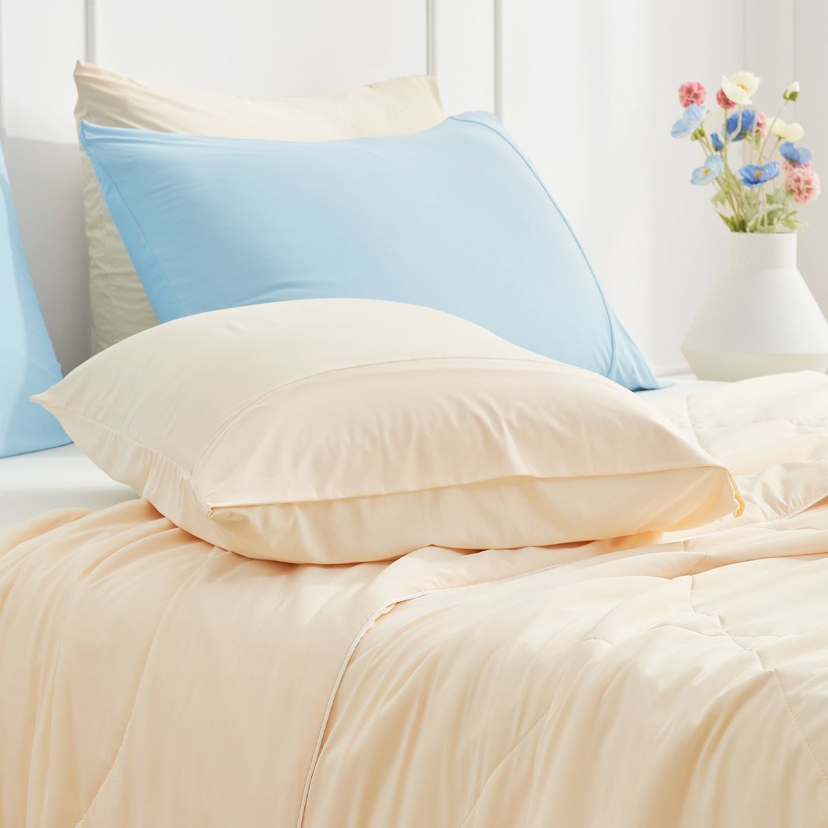 Cooling pillowcases in beige on a bed, featuring breathable, soft material for comfortable sleep #color_Yellow