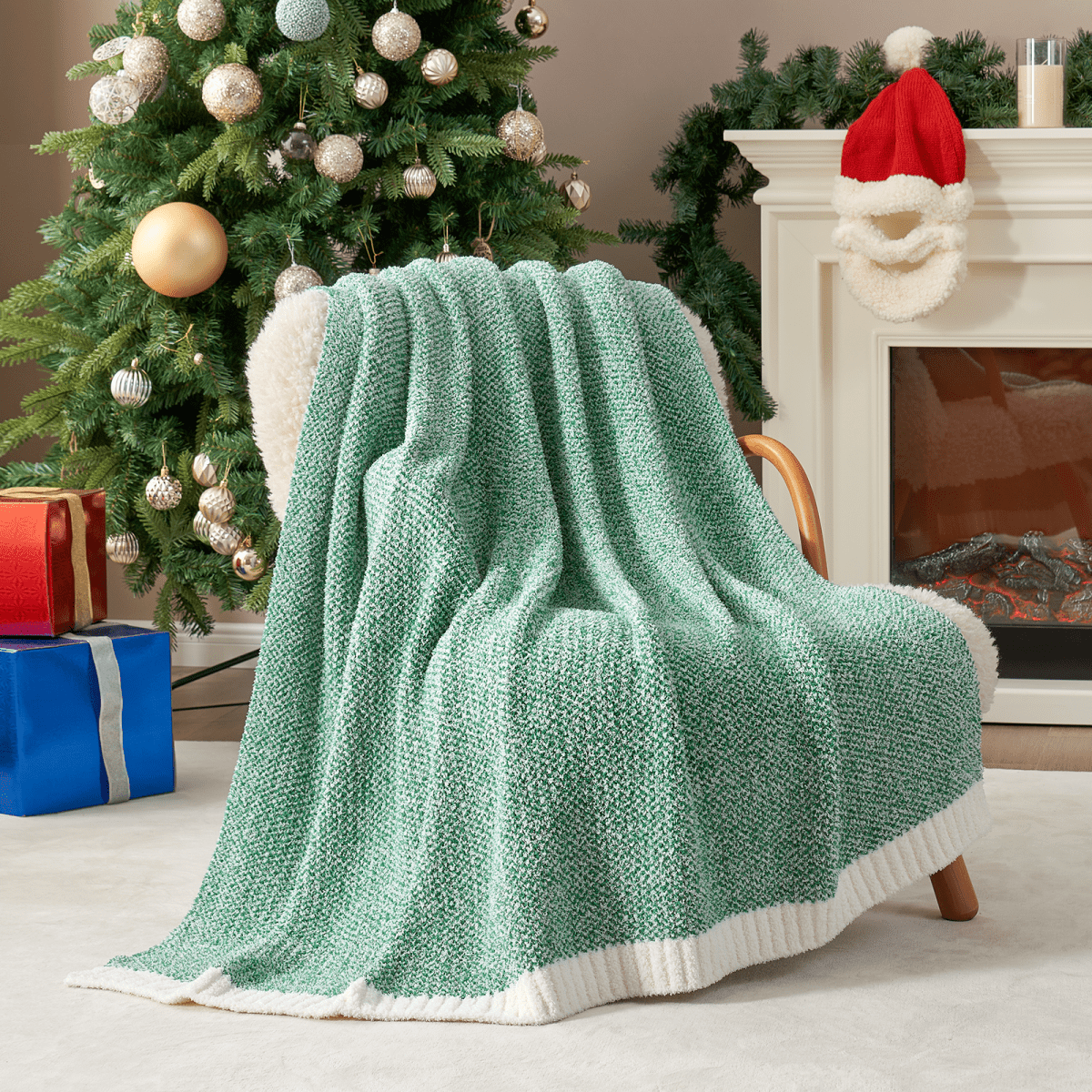 Heather Feather Yarn Throw Blanket in Heather Green draped over an armchair, creating a calm and inviting atmosphere. #color_Heather Green