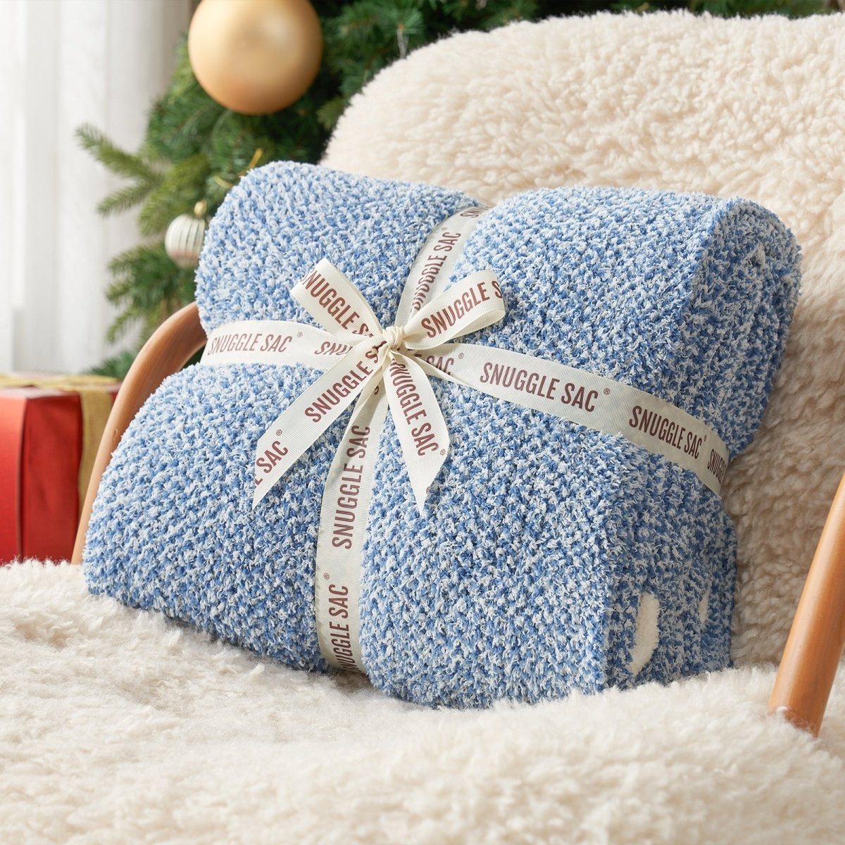 Heather Feather Yarn Throw Blanket in misty blue neatly folded with ribbon, a perfect gift idea for holidays, housewarming or special occasions. #Color_Misty Blue