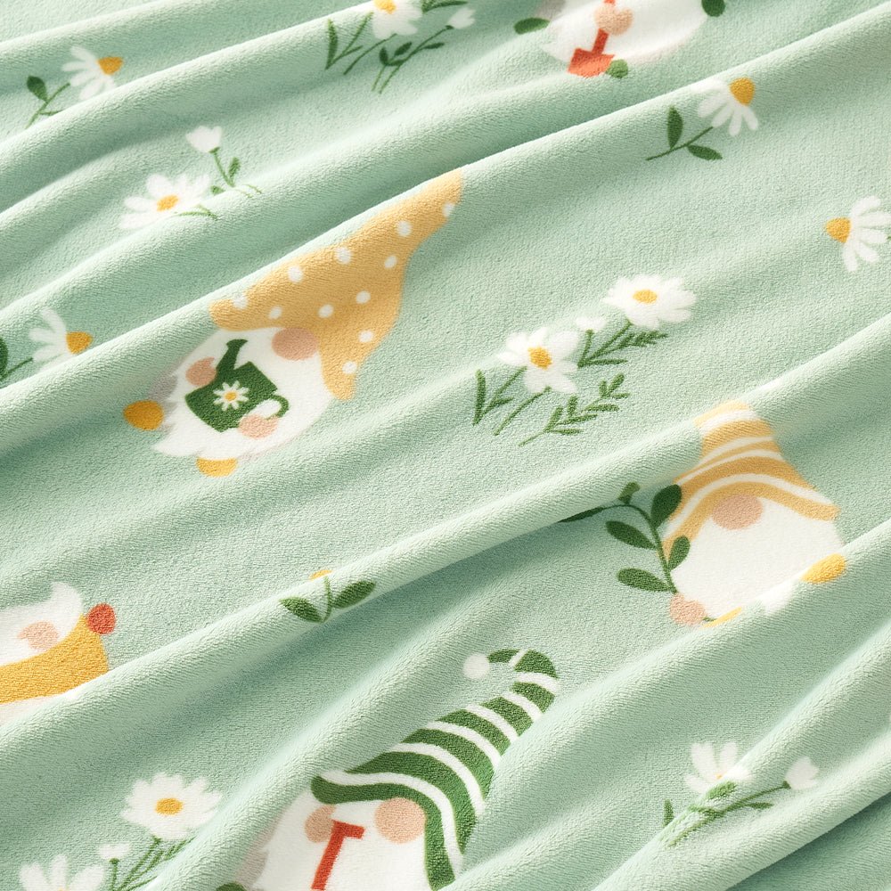 Close up of spring gnomes milkyplush throw blanket in Green, showcasing colorful gnome pattern and smooth plush texture #color_Sage Green