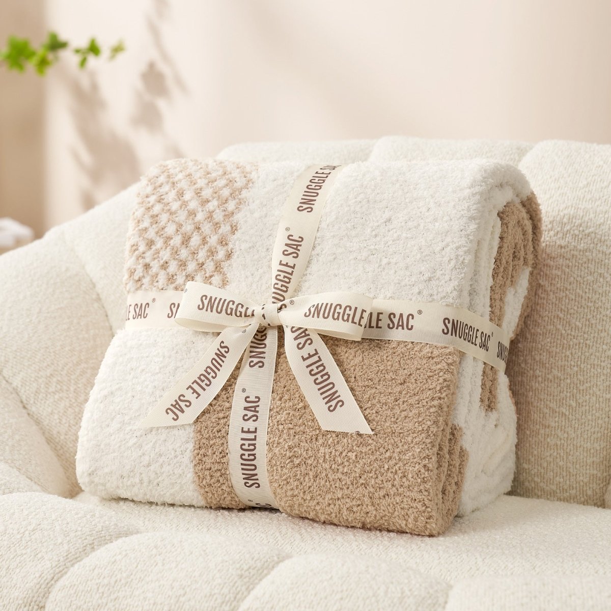 Checkered Feather Yarn Throw Blanket in Beige & White neatly folded as gift packaging, perfect for holidays and special occasions. #color_Beige & White