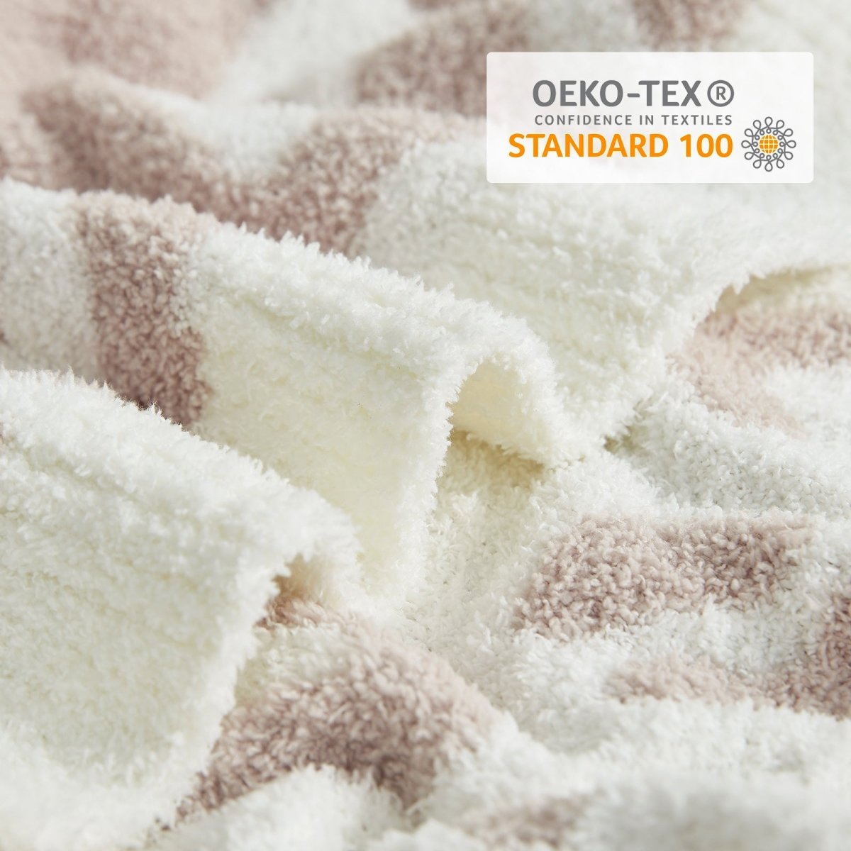 Close-up of Reversible Leopard Feather Yarn Throw Blanket in Khaki Leopard showcasing plush feather yarn texture and OEKO-TEX STANDARD 100 certification. #color_Khaki Leopard