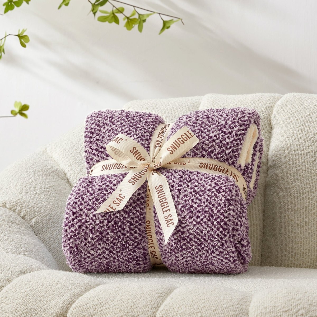 Heather Feather Yarn Throw Blanket in Lilac neatly folded with ribbon, a perfect gift idea for holidays, housewarming or special occasions. #Color_Lilac