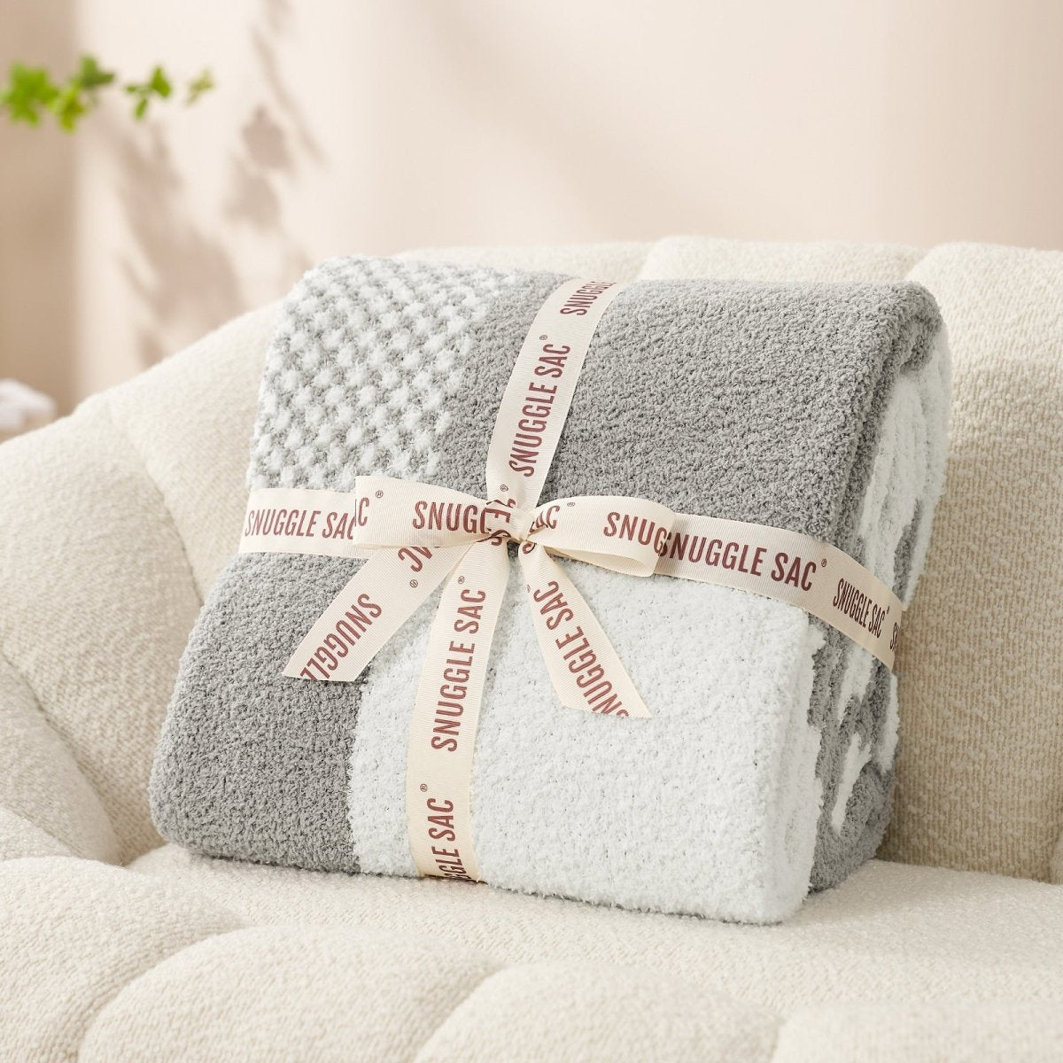 Checkered Feather Yarn Throw Blanket in Grey neatly folded as gift packaging, perfect for holidays and special occasions. #color_Grey