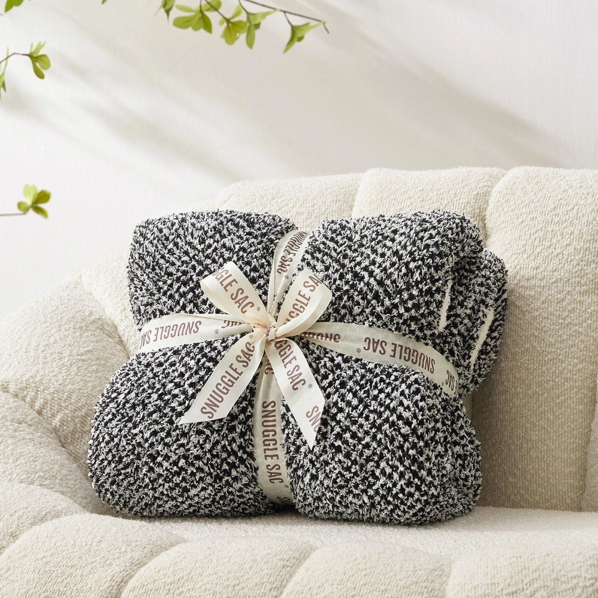 Heather Feather Yarn Throw Blanket in black neatly folded with ribbon, a perfect gift idea for holidays, housewarming or special occasions. #Color_Black