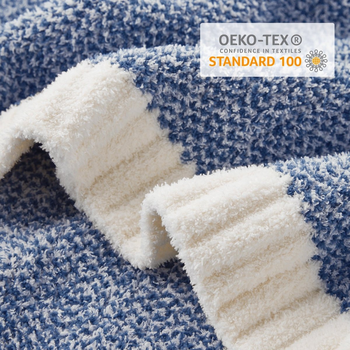 Close-up of Heather Feather Yarn Throw Blanket in Dark Blue showcasing feather yarn texture and OEKO-TEX STANDARD 100 certification. #color_Dark Blue