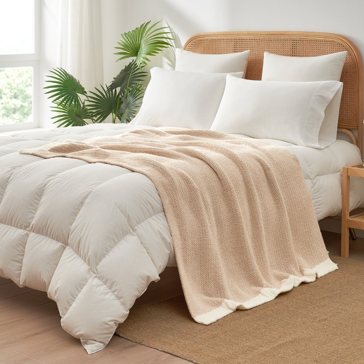 Heather Feather Yarn Throw Blanket in beige styled on a bed, enhancing bedroom decor with a soft, elegant and cozy layered look. #Color_Beige