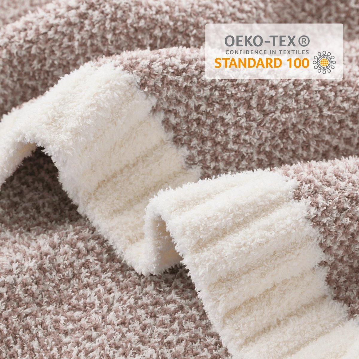Close-up of Heather Feather Yarn Throw Blanket in Brown showcasing plush texture and OEKO-TEX STANDARD 100 certification. #color_Light Brown