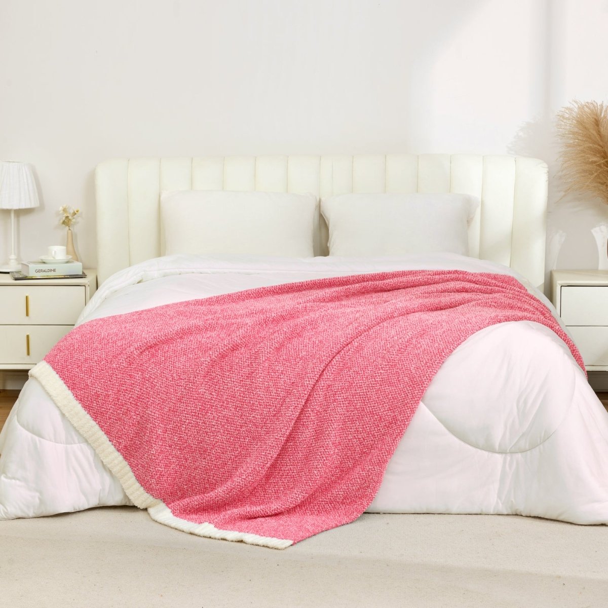 Heather Feather Yarn Throw Blanket in hot pink styled on a bed, enhancing bedroom decor with a soft, elegant and cozy layered look.  #Color_Hot Pink