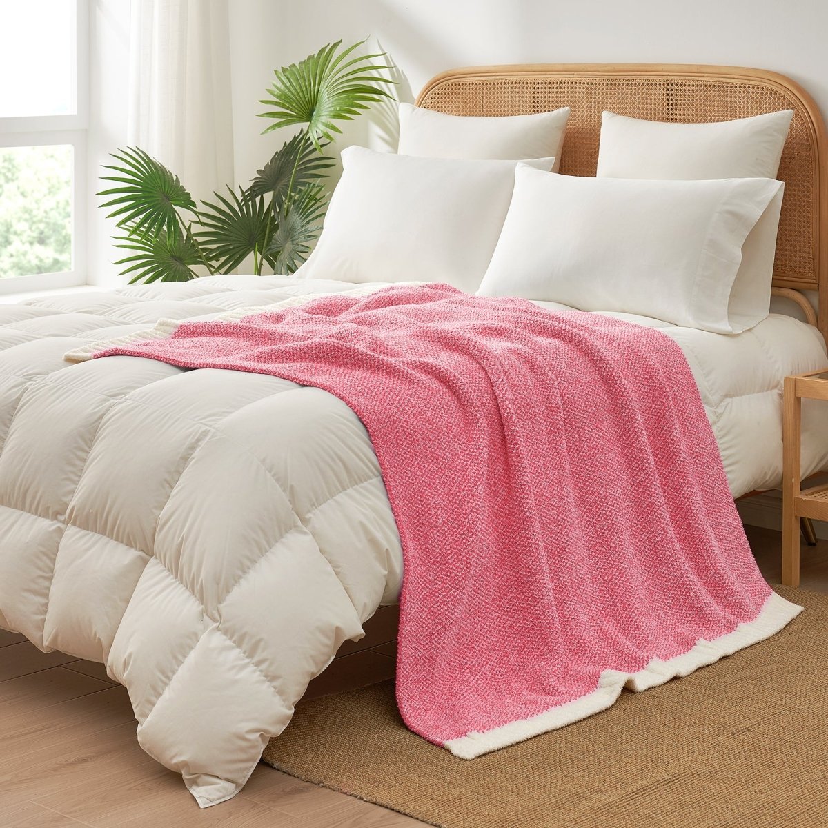 Heather Feather Yarn Throw Blanket in hot pink styled on a bed, enhancing bedroom decor with a soft, elegant and cozy layered look. #Color_Hot Pink