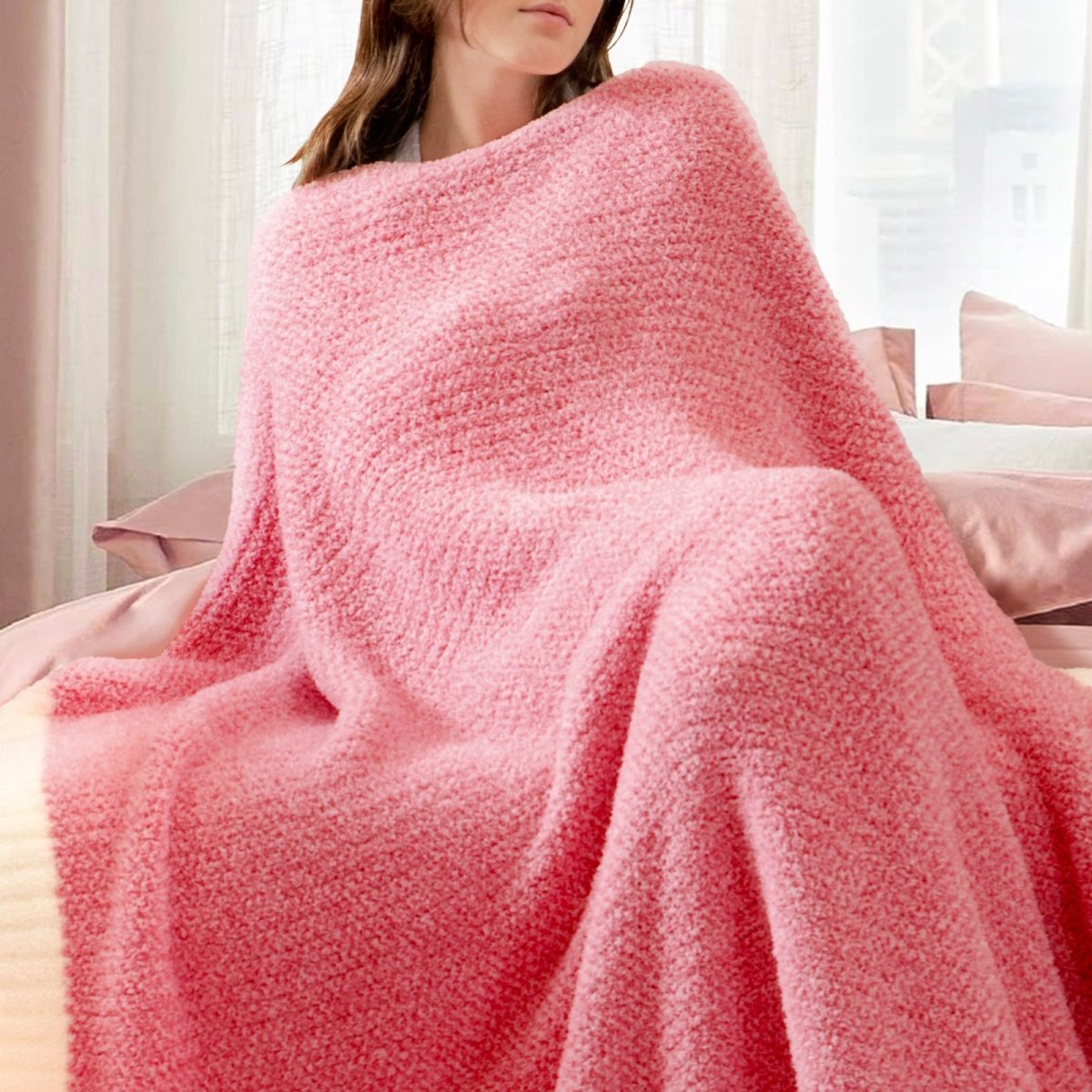 Woman wrapped in a Heather Feather Yarn Throw Blanket in Hot Pink, relaxing comfortably. #color_Hot Pink