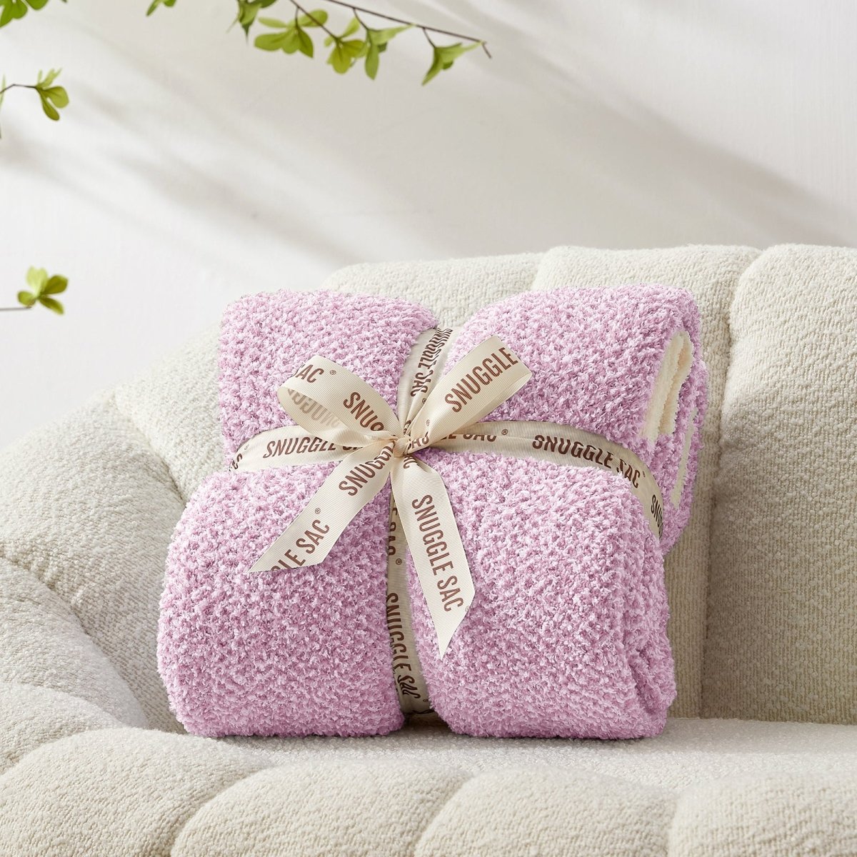 Heather Feather Yarn Throw Blanket in Purple neatly folded with ribbon, a perfect gift idea for holidays, housewarming or special occasions. #Color_Purple