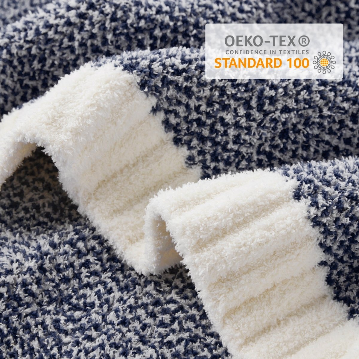 Close-up of Heather Feather Yarn Throw Blanket in Navy Blue showcasing plush feather yarn texture and OEKO-TEX STANDARD 100 certification. #color_Navy Blue