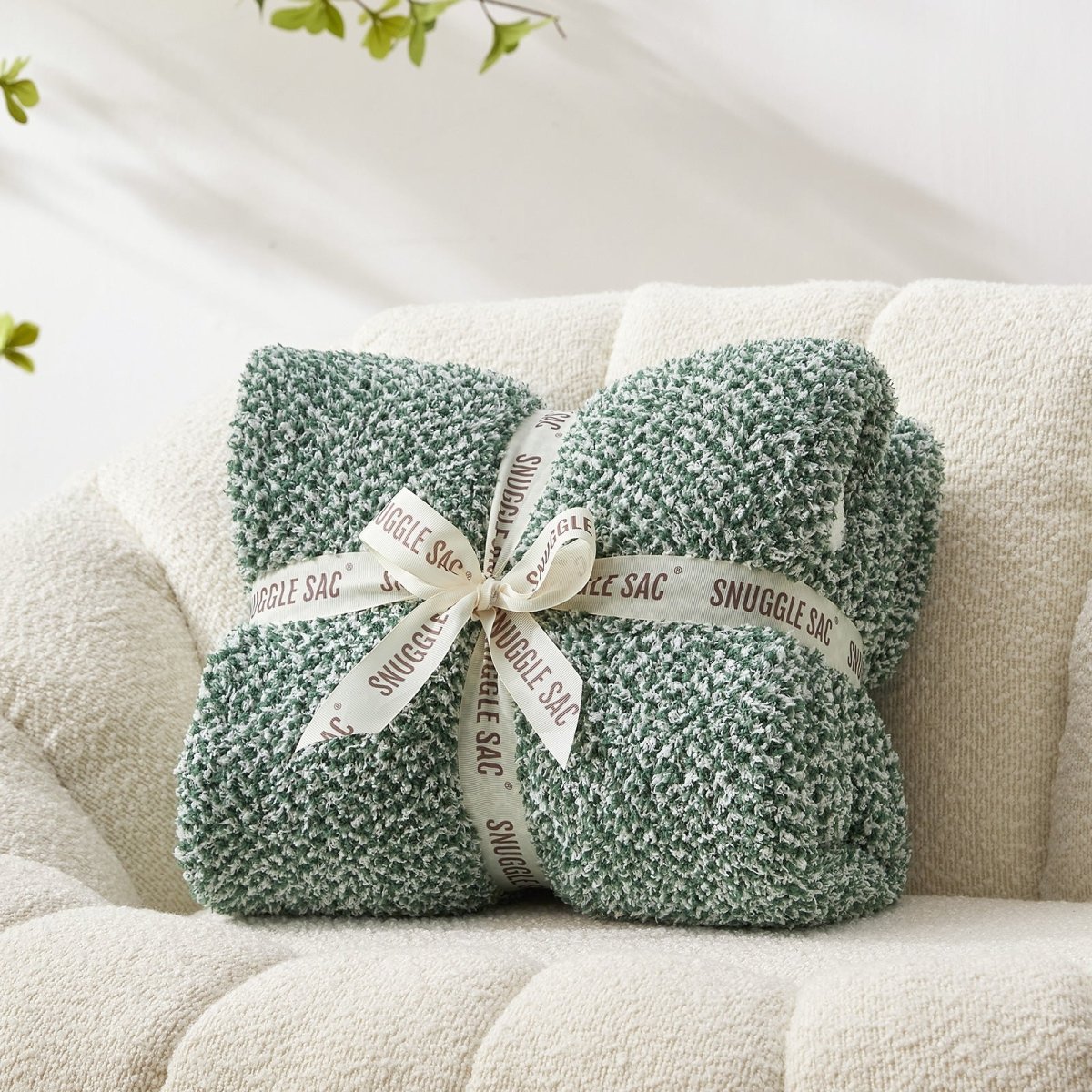 Heather Feather Yarn Throw Blanket in heather green neatly folded with ribbon, a perfect gift idea for holidays, housewarming or special occasions.  #Color_Heather Green